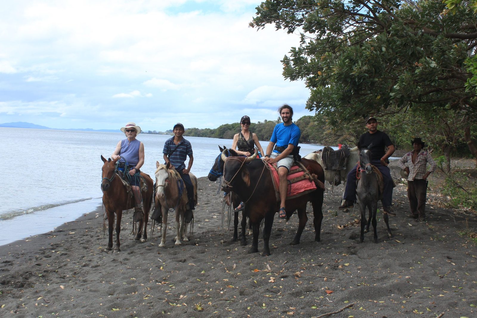 Horseback tour group on the shore of Lake Nicaragua