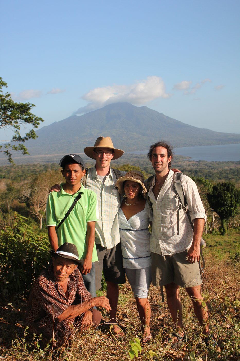 Visitors at a hilltop mirador overlooking Lake Nicaragua and the volcano